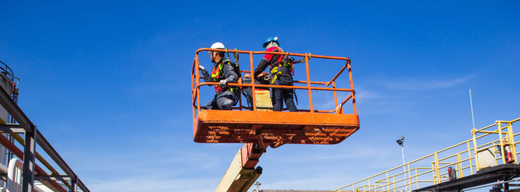 Image of two men in aerial lift