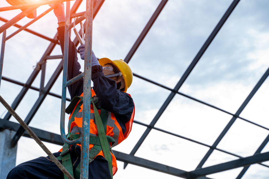 Image of a worker in ladder practicing safety training