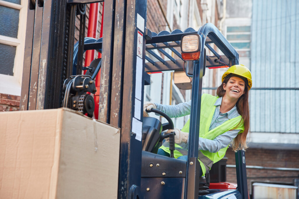 Image of young woman taking forklift training