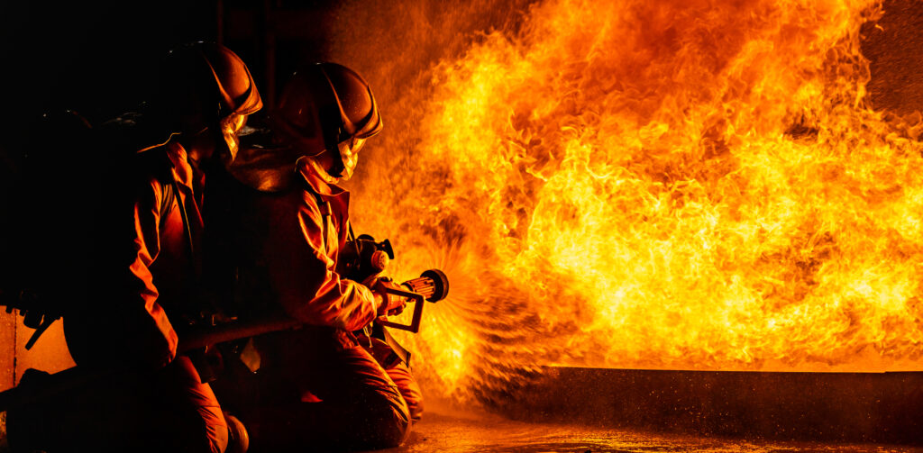 Image of a man doing fire extinguishing